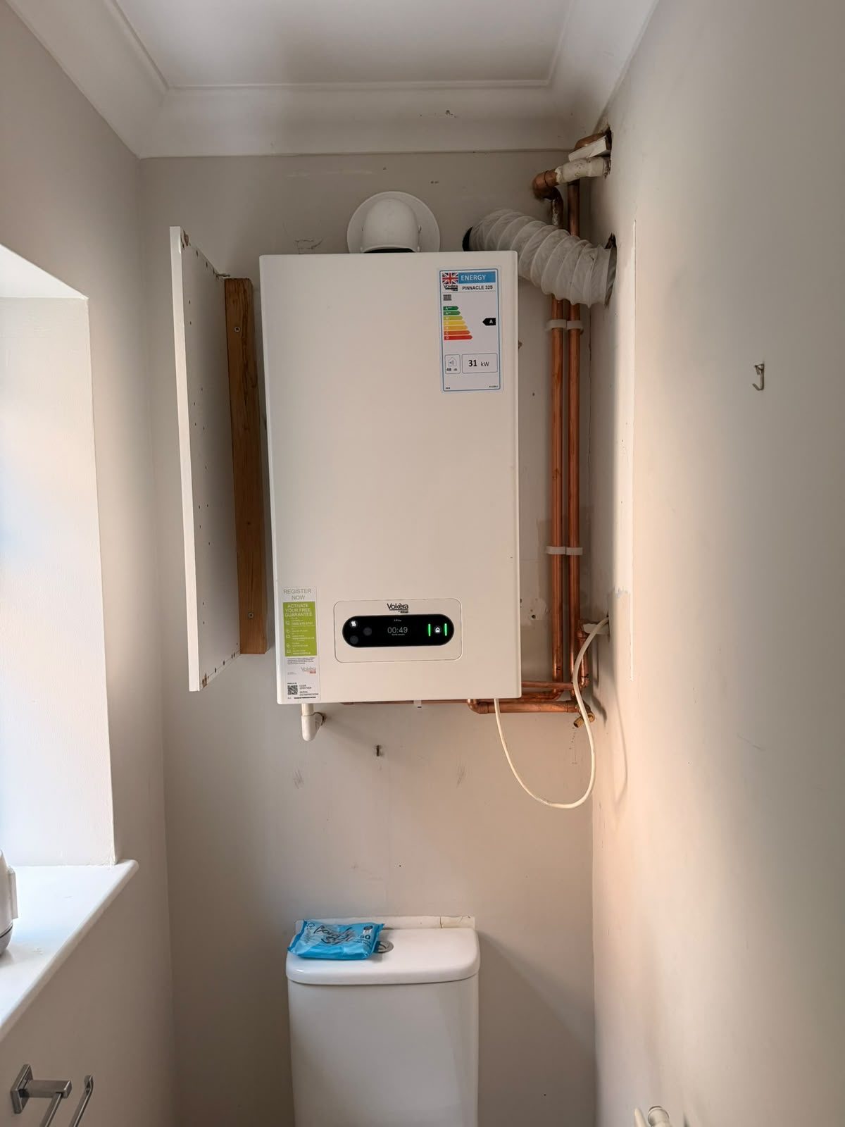 Wall-mounted Vokera combi boiler installed by a Gas Safe registered engineer